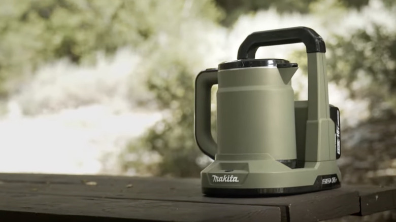 Makita kettle on table in woods