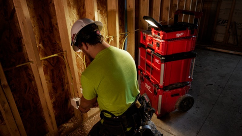 Person working under light