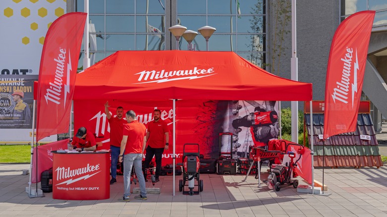 men at Miwaukee tool booth