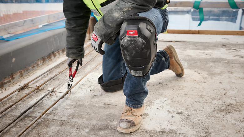 man using pliers