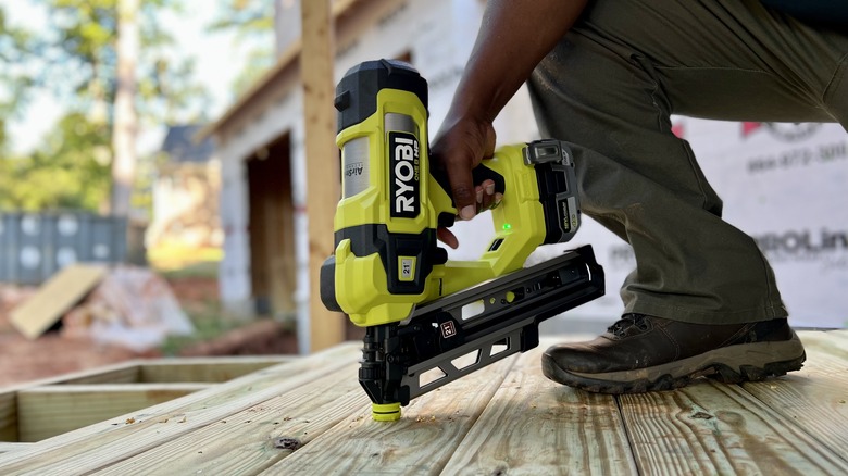 18V One+ Airstrike 21-degree Framing Nailer being used on deck