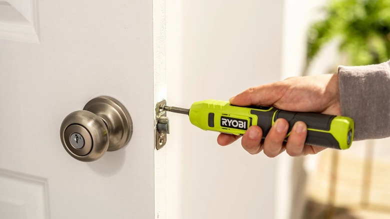 4V Cordless Screwdriver being used on door