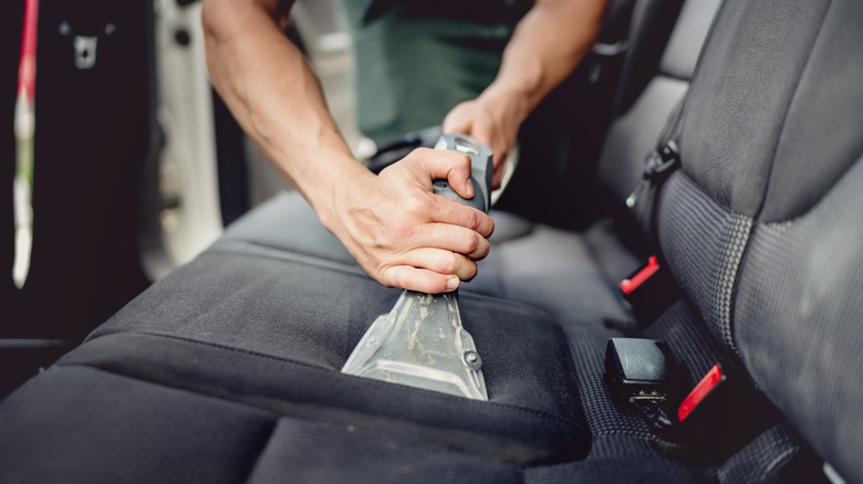 vacuuming car interior