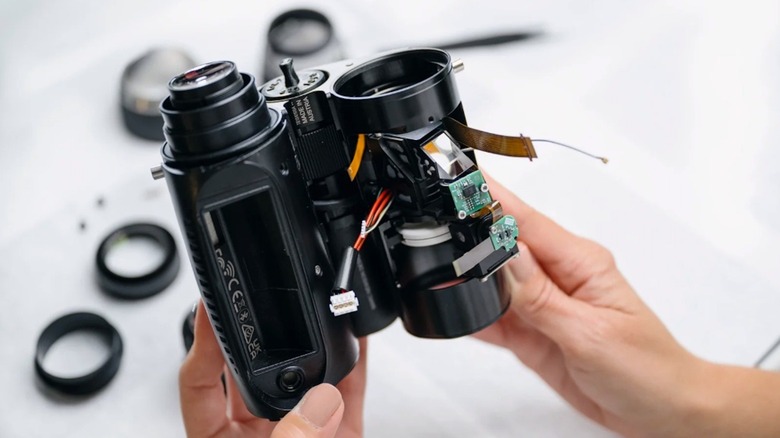 person holding Swarovski smart binoculars