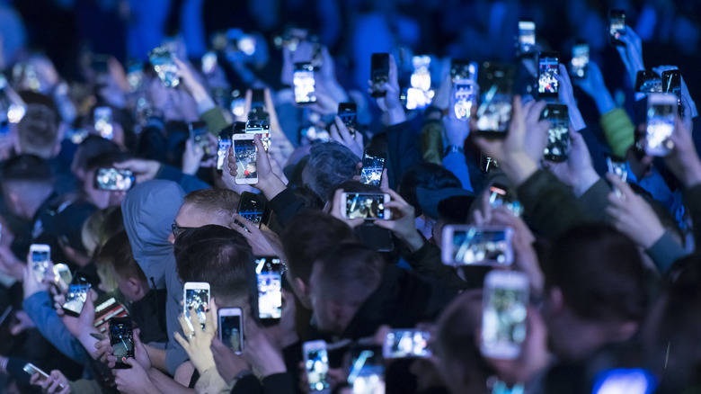 phone screens in crowd