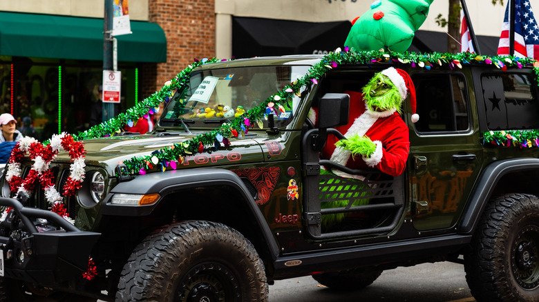 Grinch driving Jeep