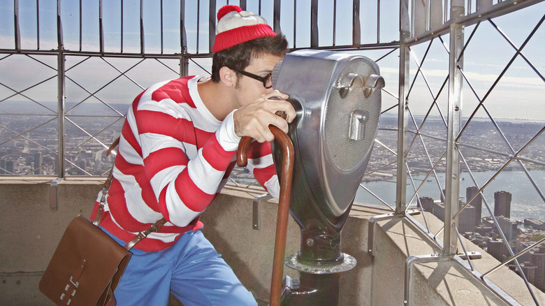 Person dressed as Waldo on rooftop