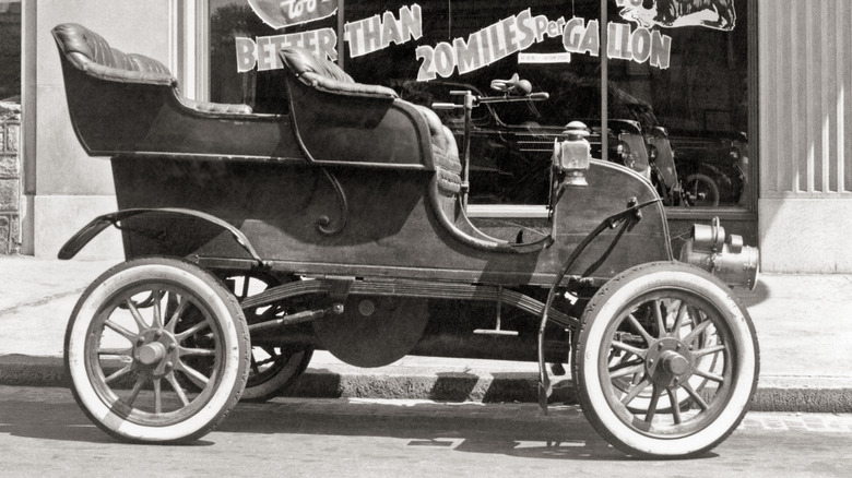 Model A parked outside store