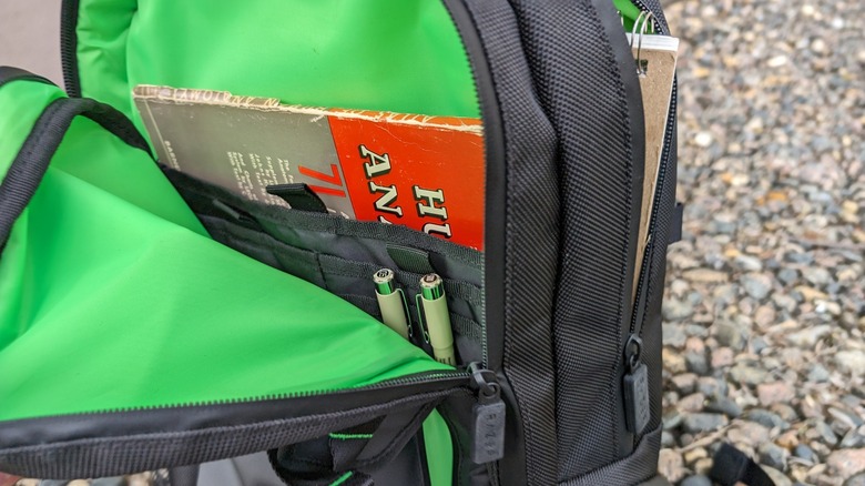 Razer backpack open with books inside