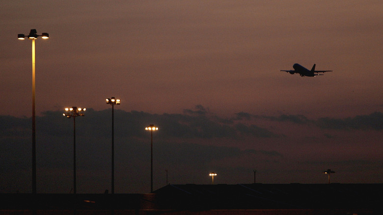 Sunset airplane in flight