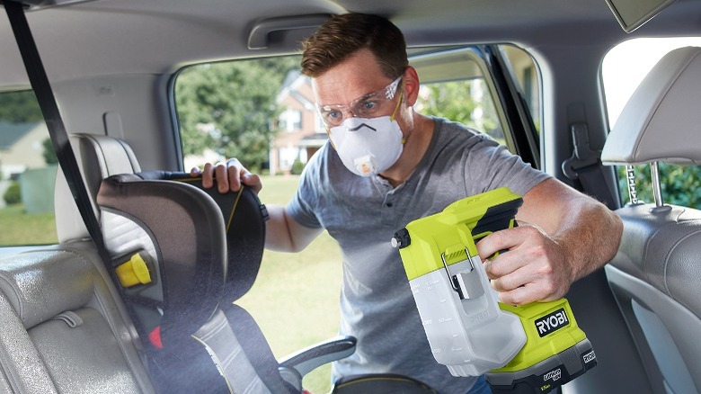 Person using Ryobi sprayer