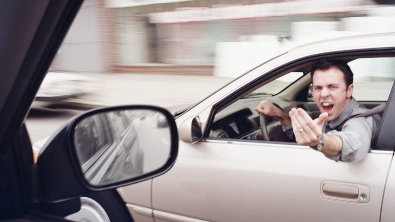 Man screaming out car window