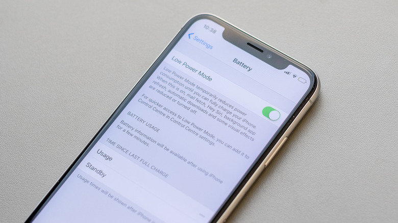 iPhone X showing Battery settings menu with Low Power Mode toggle on
