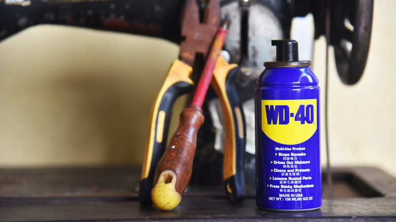 can of wd-40 next to tools