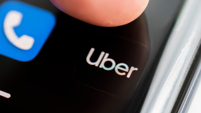 Finger tapping Uber mobile icon