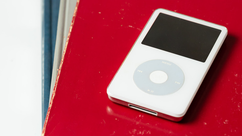 Apple iPod Classic on a red book