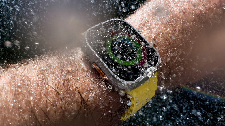 Apple Watch being splashed with water