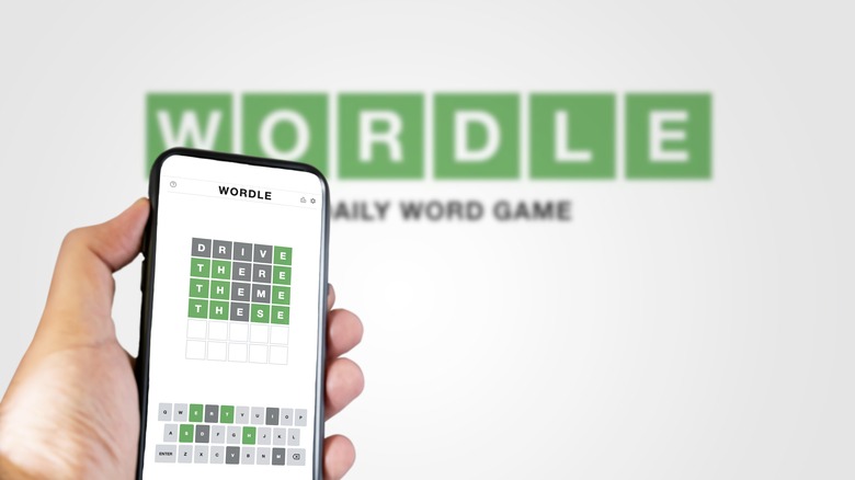Person playing Wordle on smartphone