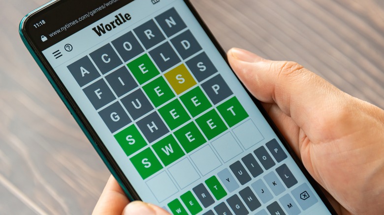 person playing Wordle on smartphone