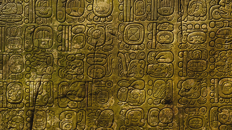 Mayan script carved on a wall