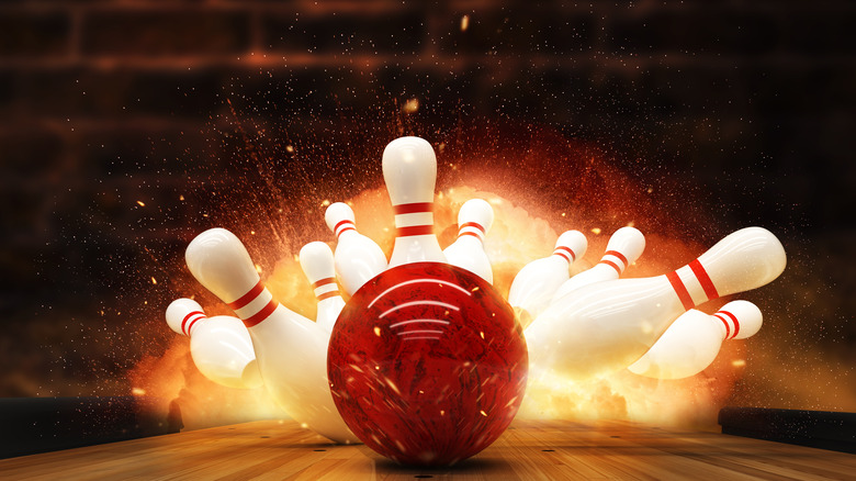 bowling ball hitting pins and exploding