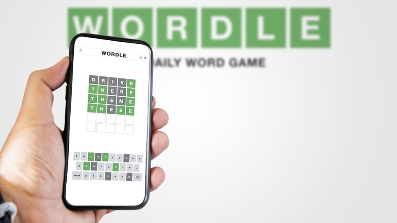 Person playing Wordle on smartphone