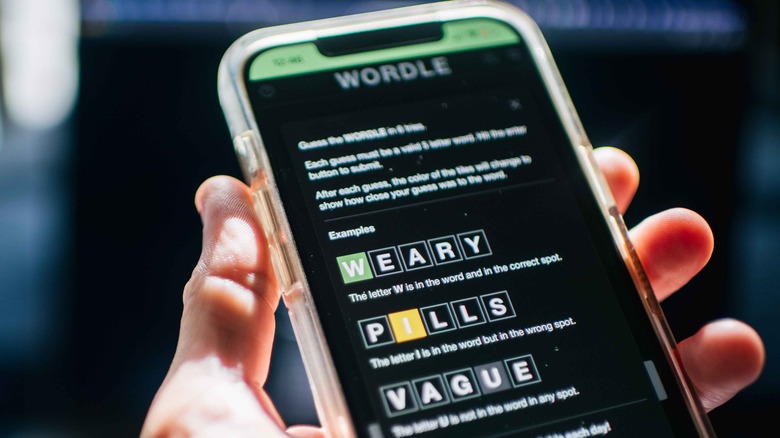 The online puzzle game Wordle being played on an iPhone.