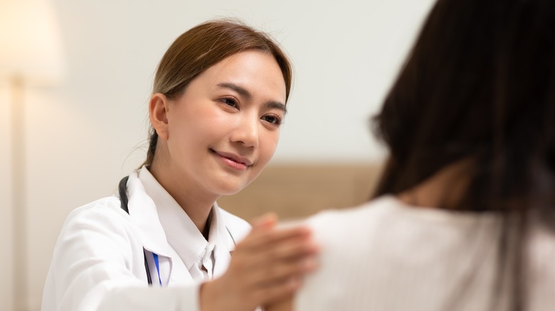 doctor encouraging a patient