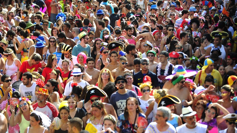 crowd of people partying in a parade