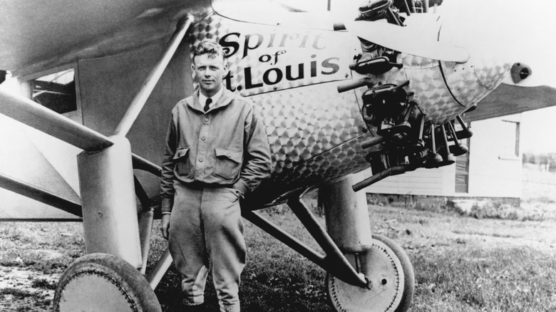 Charles A. Lindbergh in front of his plane