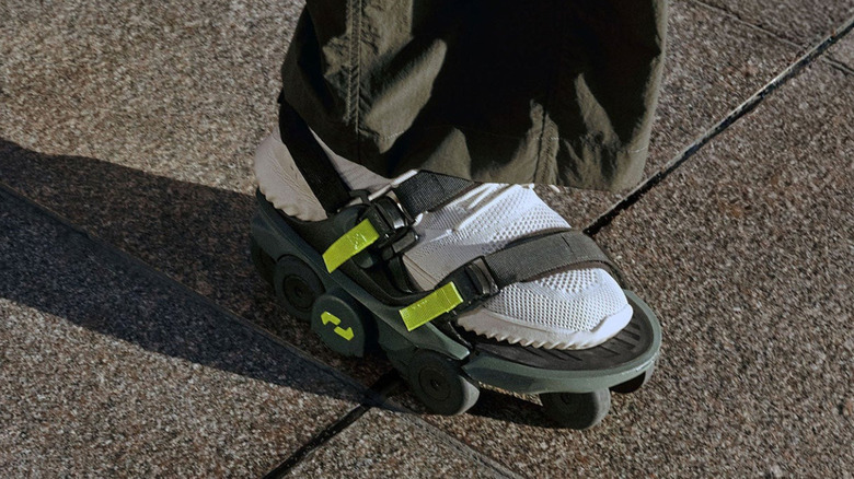 A person wearing the Moonwalkers skate-style sandals.