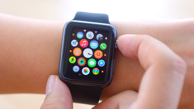 A person using an Apple Watch on a wrist