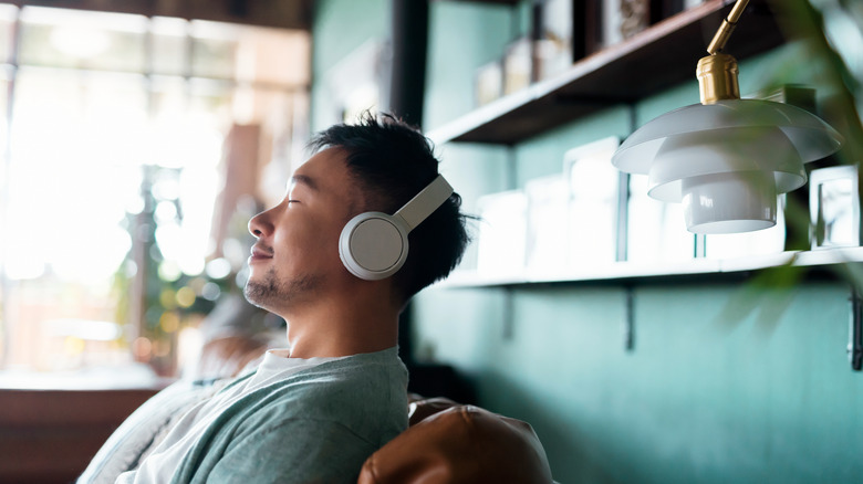 Man listening to music on wireless headphones