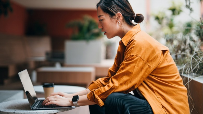 lady cleaning a laptop