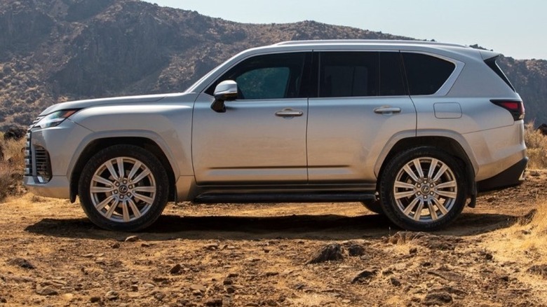 Lexus LX parked off-road with mountains in the background