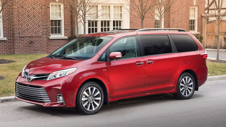 A red 2018 Toyota Sienna on a street