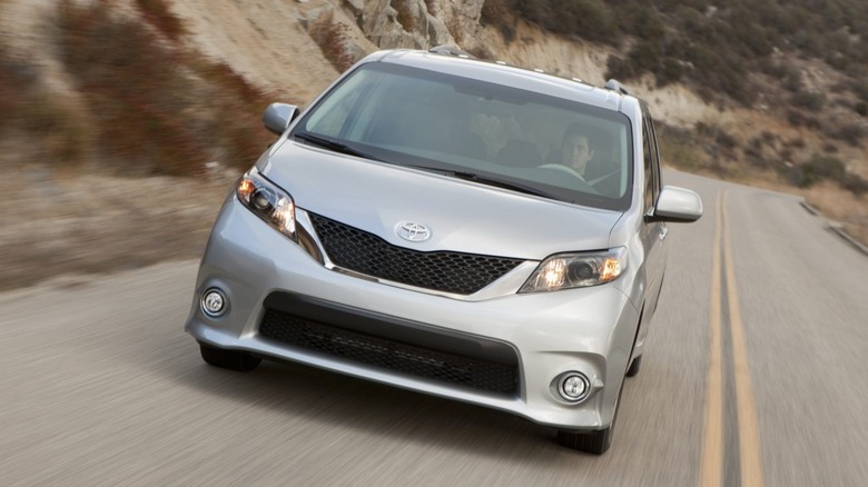 Silver 2011 Toyota Sienna on the road