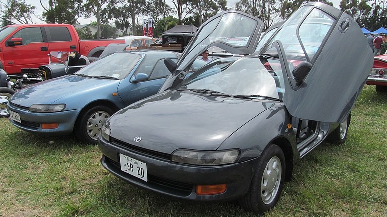 A Toyota Sera with its gull-wing doors open