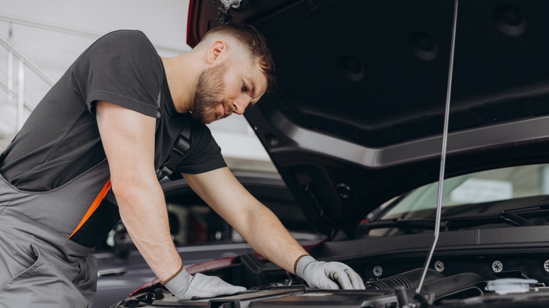 Mechanic working on engine