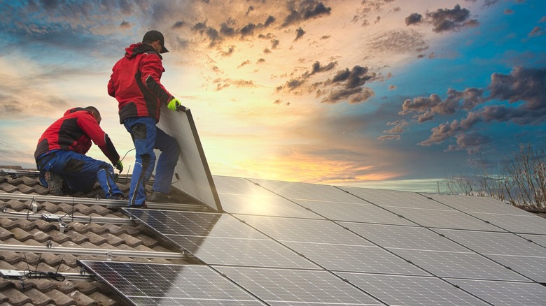 Solar panels being installed on a rooftop