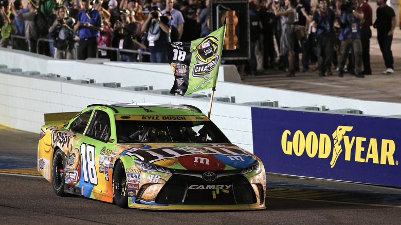 Kyle Busch with Sprint Cup Winner flag