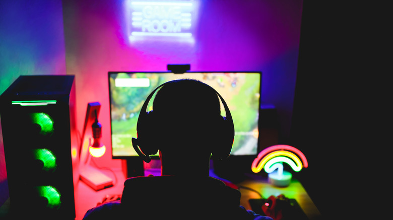 Silhouetted streamer playing game
