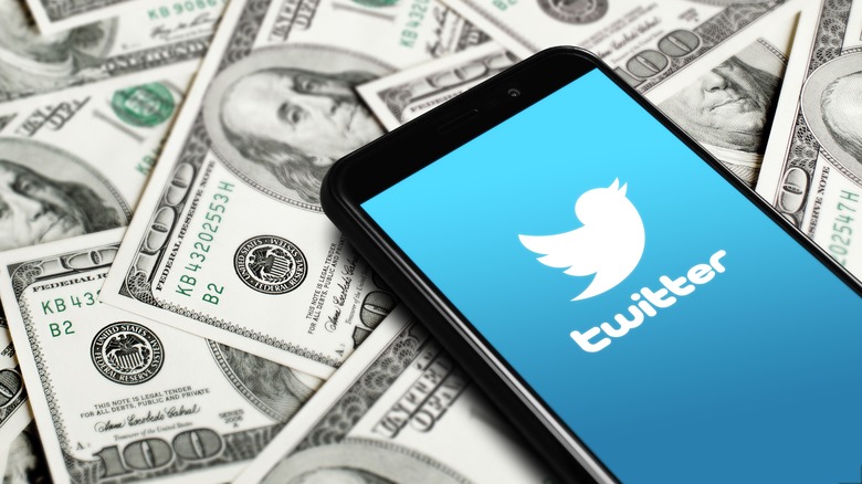 Phone with twitter logo on money