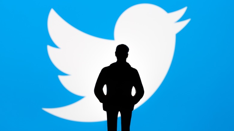 Man and Twitter logo