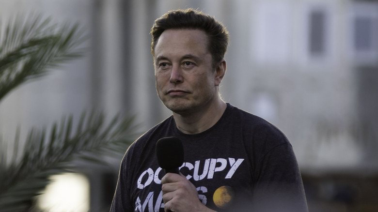 Elon Musk speaking at an event