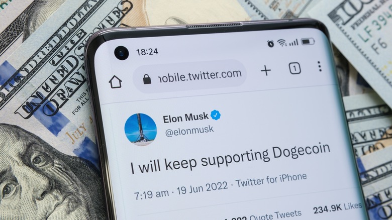 Smartphone screen showing a tweet by Elon Musk.