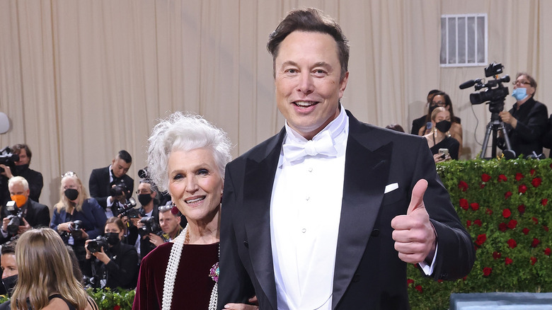 Elon Musk White Tie Thumbs Up