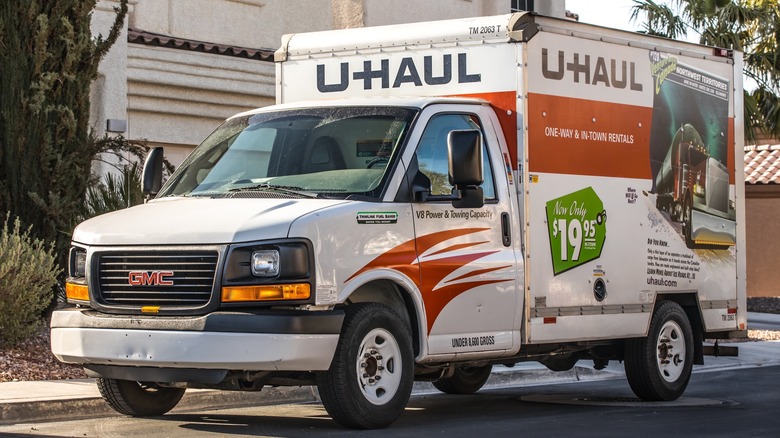 10 foot U-Haul truck parked next to house