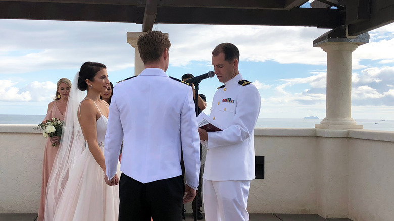 Navy Chaplain performing wedding ceremony