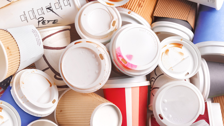 Discarded coffee containers which are difficult to recycle due to the mix of materials